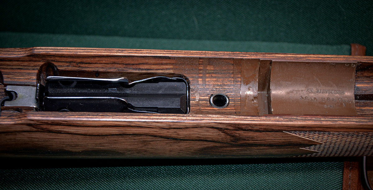The Mark VII is presently available only with a blind magazine although a hinged floor plate or detachable magazine is being considered. Note the pads of synthetic bedding material positioned behind and in front of the recoil lug of the receiver. From the front pad on, the barrel free floats.